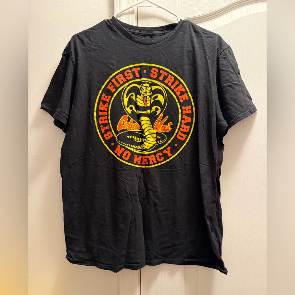 Bioworld Black Cobra Kai Emblem Tee with Yellow and Red Accents